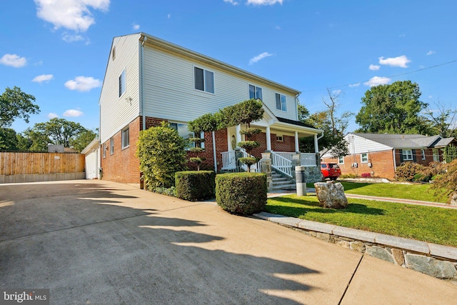 view of front of property with a front yard and a porch