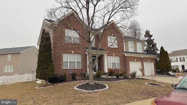 view of front of house featuring a garage and a front yard