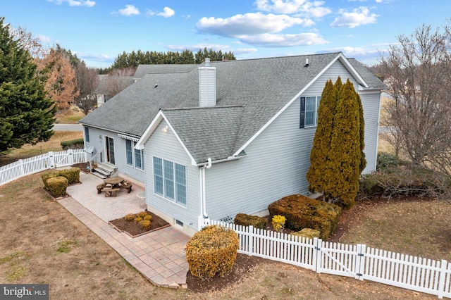 rear view of property with a patio area