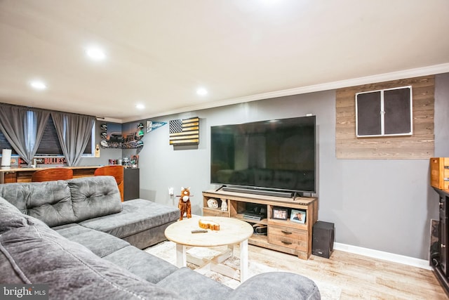 living room with crown molding and wood-type flooring