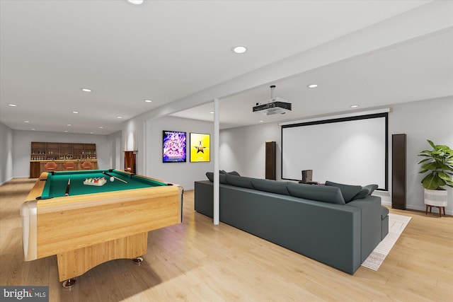 rec room with light hardwood / wood-style floors, billiards, and indoor bar