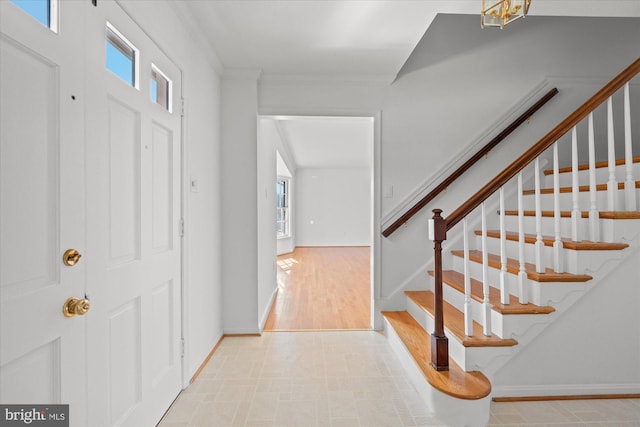 foyer entrance with ornamental molding