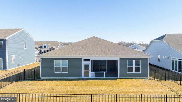 rear view of house with a yard