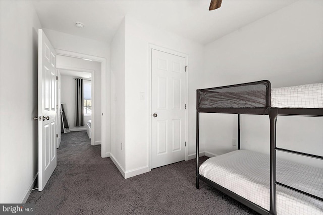 bedroom with dark colored carpet