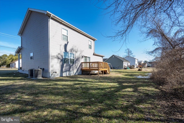 back of property with a wooden deck, central AC, and a lawn