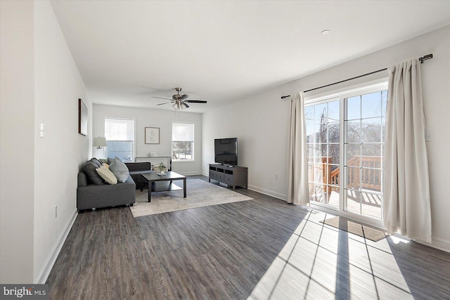 living room with hardwood / wood-style flooring and ceiling fan