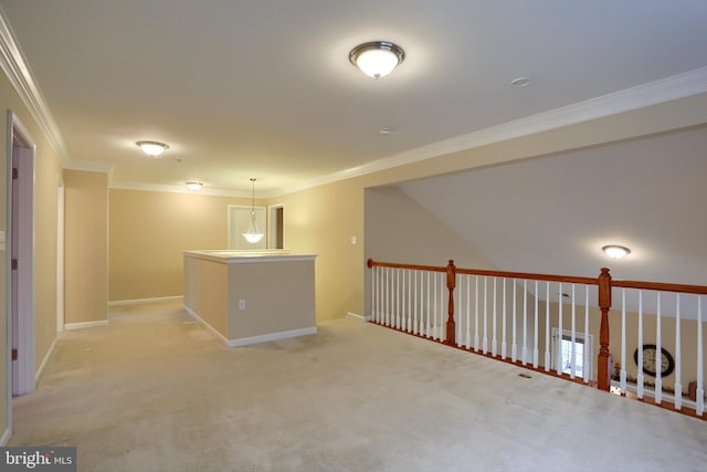 carpeted spare room featuring crown molding