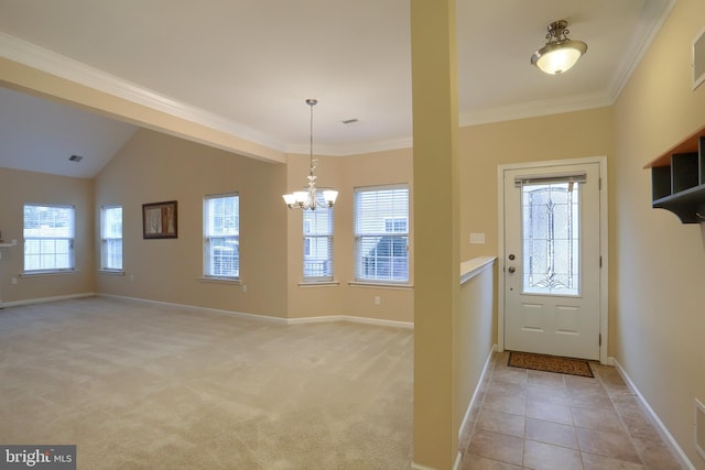 carpeted entryway with an inviting chandelier, crown molding, and a wealth of natural light