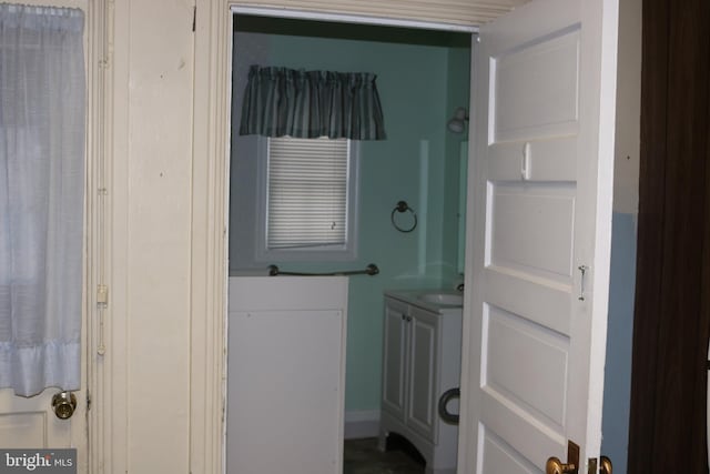 laundry area featuring washer and clothes dryer and sink