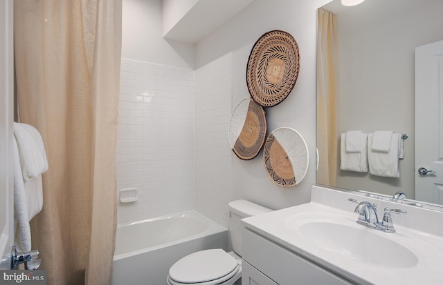 full bathroom featuring shower / bathtub combination with curtain, vanity, and toilet