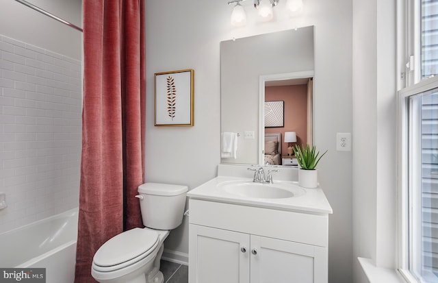 full bathroom featuring vanity, shower / bath combo, and toilet