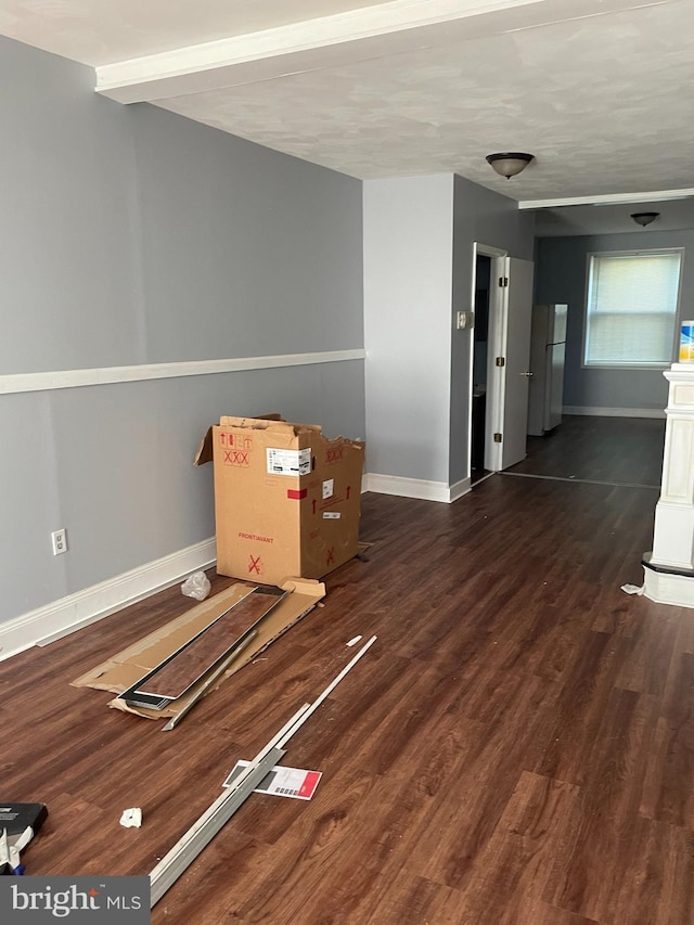 spare room with dark hardwood / wood-style floors