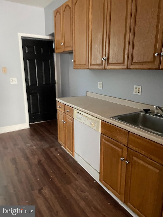 kitchen featuring dark hardwood / wood-style floors, dishwasher, and sink