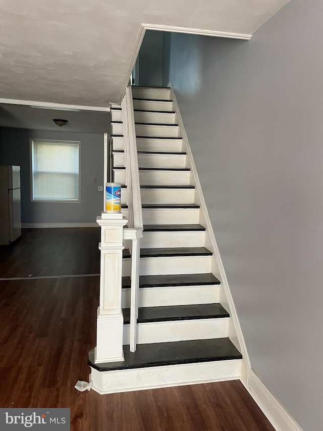 stairs with hardwood / wood-style flooring