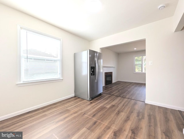 kitchen with hardwood / wood-style flooring and stainless steel fridge