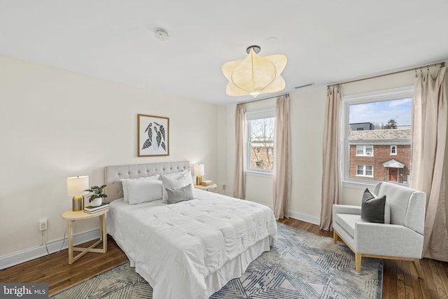 bedroom with wood-type flooring