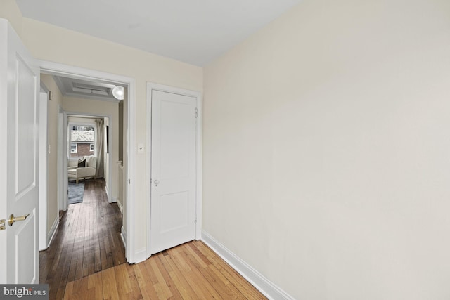 corridor featuring wood-type flooring