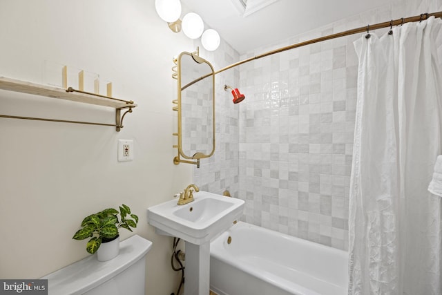 bathroom with shower / bath combination with curtain and toilet