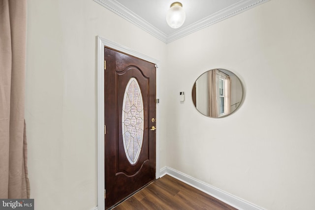 entryway with crown molding and dark hardwood / wood-style floors