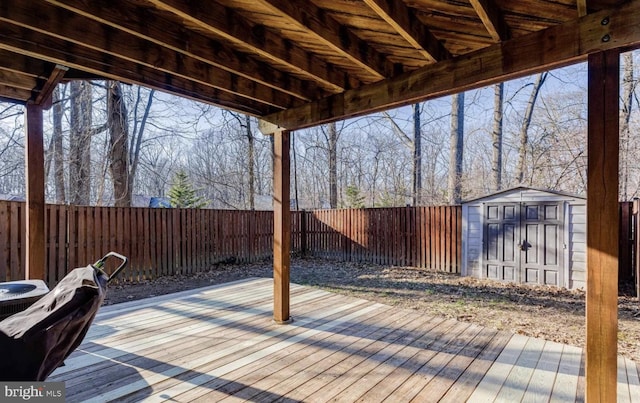 wooden deck featuring a storage shed