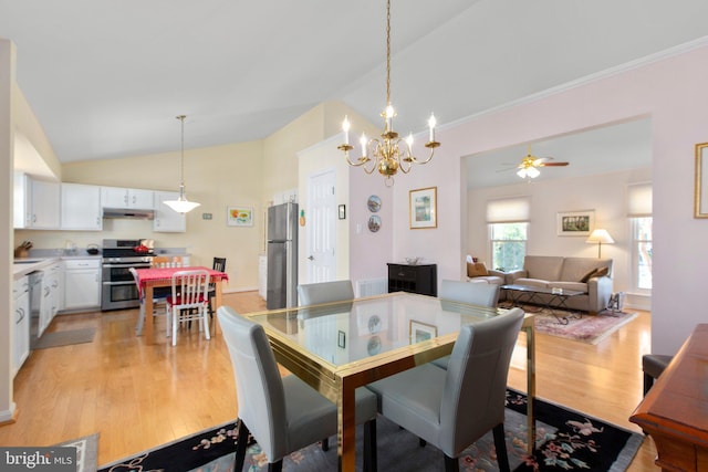 dining area with lofted ceiling, ceiling fan, and light wood-style floors