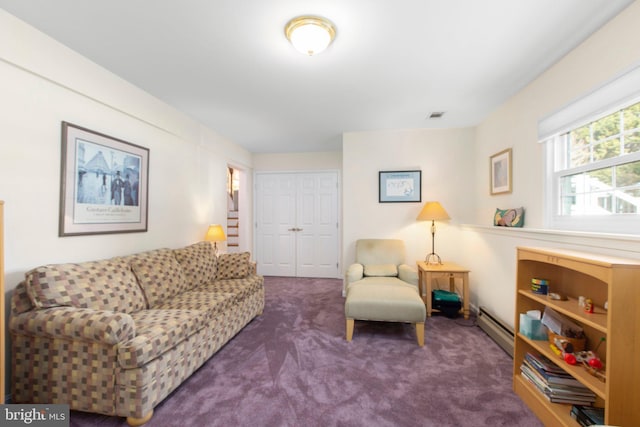 living room with visible vents, stairs, a baseboard heating unit, and dark carpet