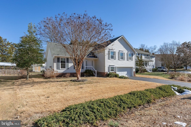 view of front of property featuring driveway and an attached garage