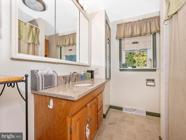 bathroom featuring vanity and tile patterned floors