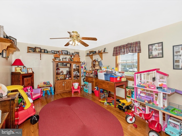 recreation room with wood-type flooring and ceiling fan