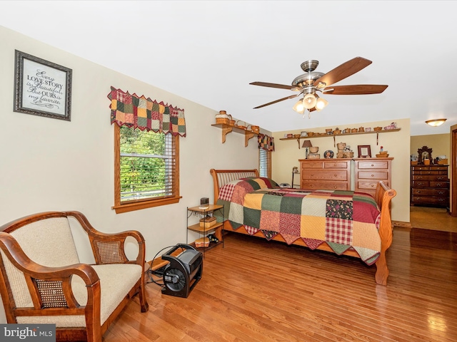 bedroom featuring ceiling fan and wood-type flooring