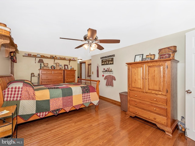 bedroom with light hardwood / wood-style flooring and ceiling fan