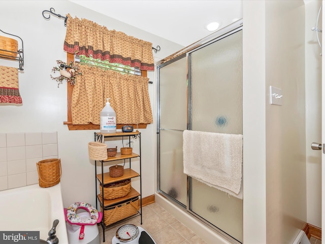 bathroom with walk in shower and tile patterned floors