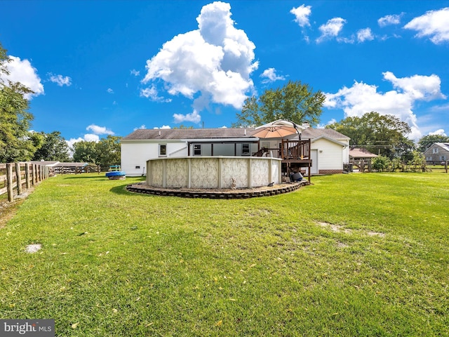 back of property featuring a yard