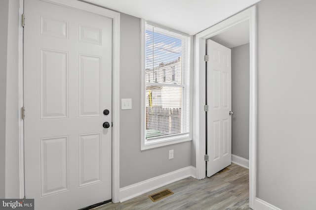 doorway featuring light hardwood / wood-style floors