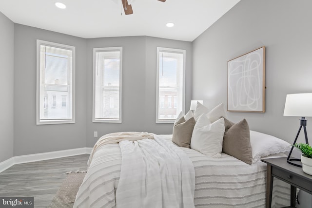 bedroom featuring hardwood / wood-style flooring and ceiling fan