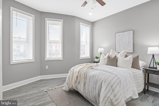 bedroom with wood-type flooring and ceiling fan