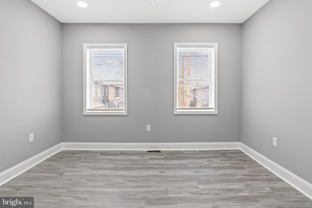 unfurnished room featuring light hardwood / wood-style flooring