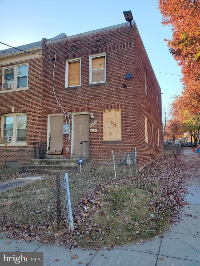 view of front of house featuring cooling unit