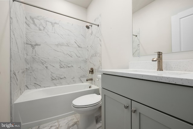 full bathroom featuring vanity, toilet, and tiled shower / bath