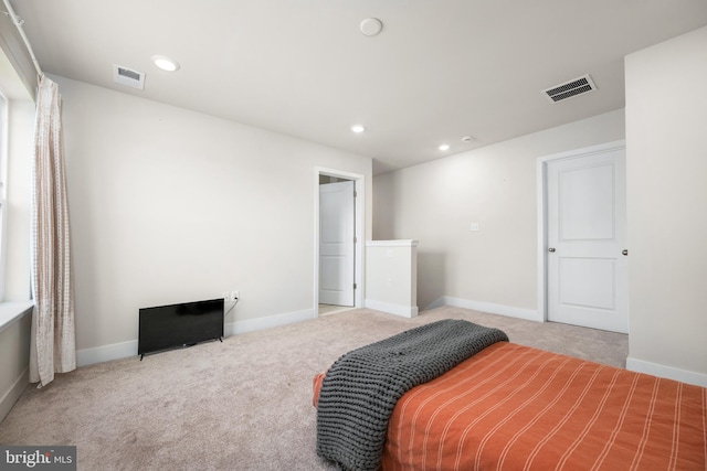 bedroom with light colored carpet