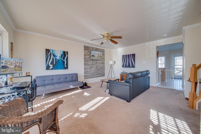 carpeted living room featuring crown molding and ceiling fan