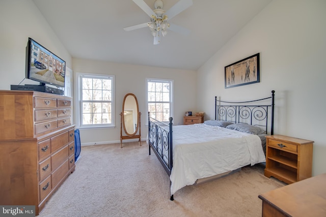 bedroom featuring ceiling fan, lofted ceiling, and light carpet