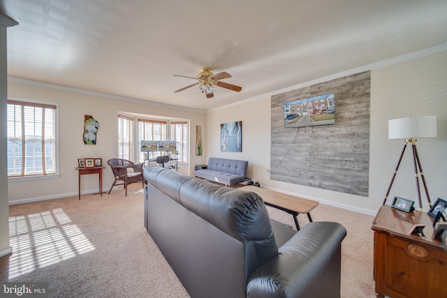 living room featuring light carpet, ornamental molding, and ceiling fan