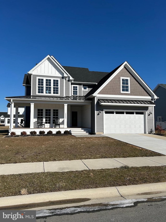 craftsman house featuring a garage and covered porch