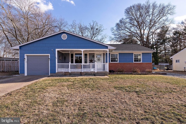 ranch-style home featuring a porch, a garage, and a front yard