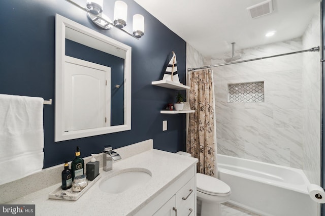 full bathroom featuring vanity, shower / tub combo, and toilet