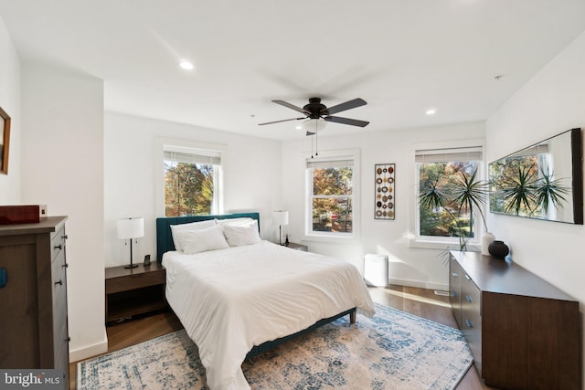 bedroom with hardwood / wood-style flooring and ceiling fan