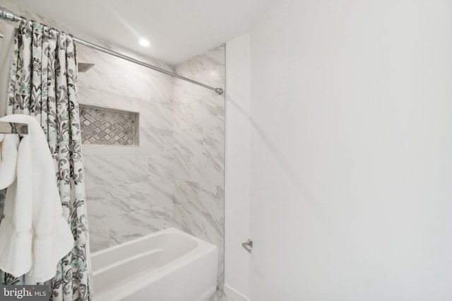 bathroom featuring shower / tub combo with curtain