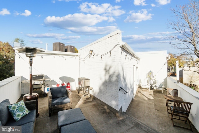 view of patio featuring a grill and an outdoor hangout area