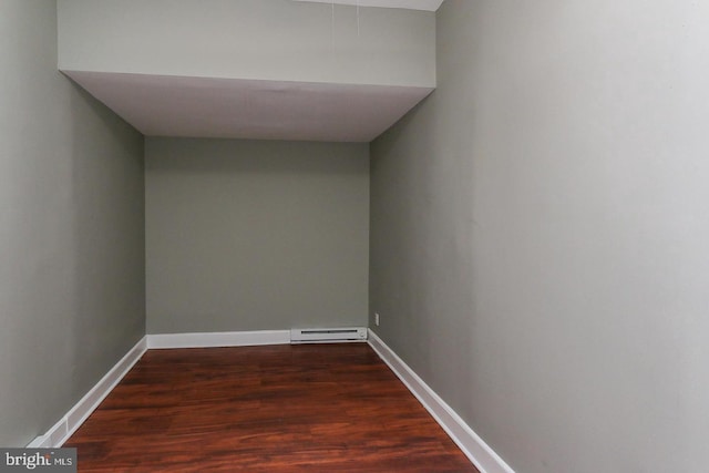 interior space featuring a baseboard radiator and dark hardwood / wood-style floors